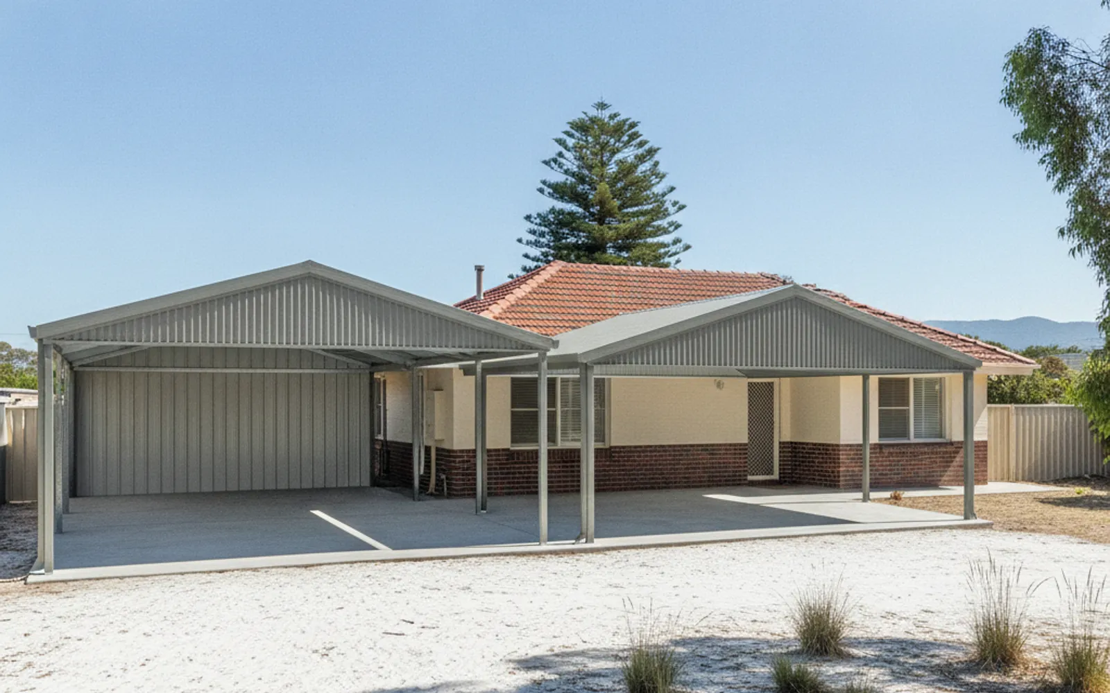Colorbond patio roof on steel posts over a backyard alfresco area